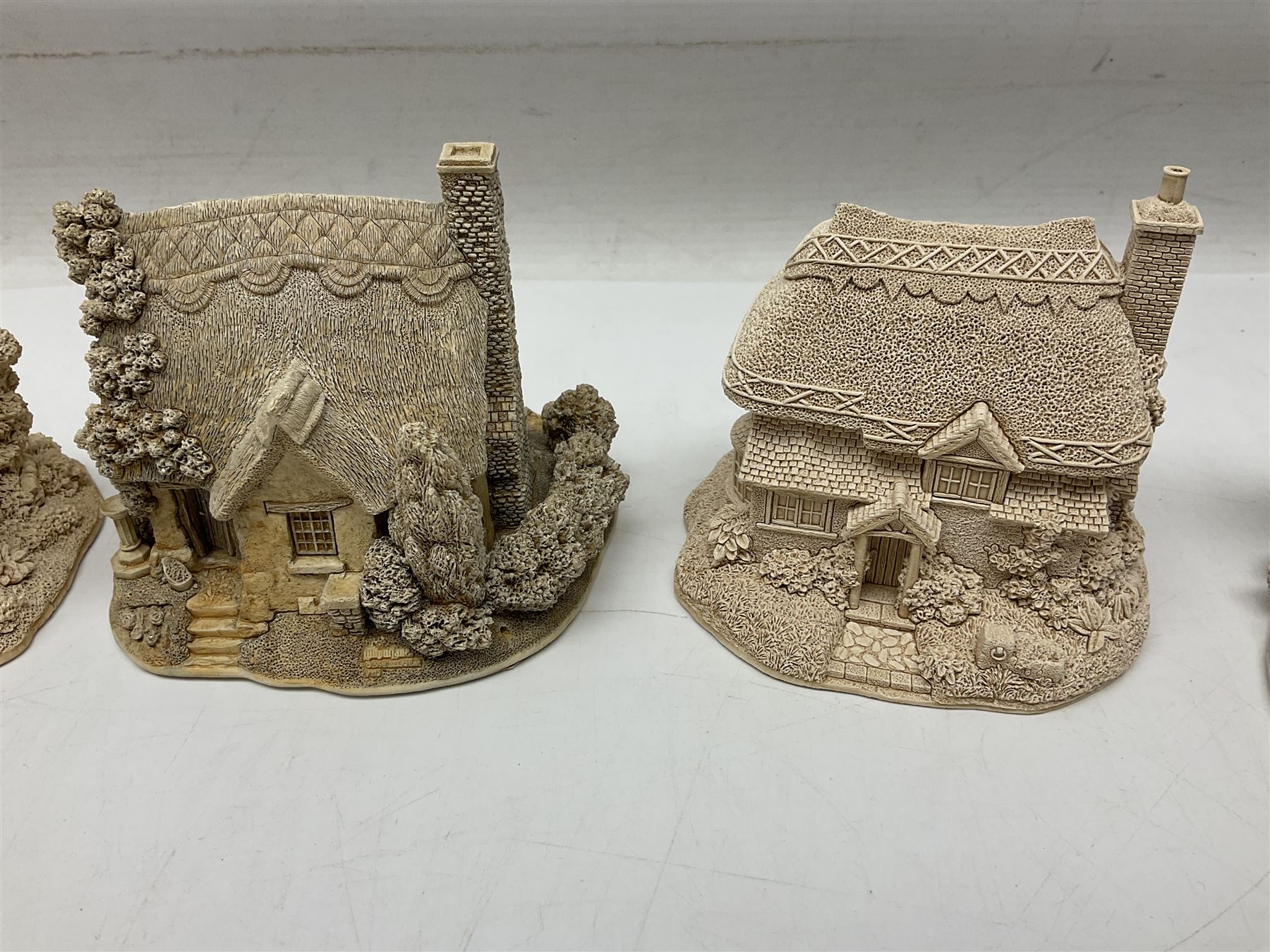 Twenty-three Lilliput Lane models from the Paint Your Own collection, to include Catmint Cottage, Sugar and Spice, Gypsy Cottage, Ruby Cottage and Little Birch, some boxed