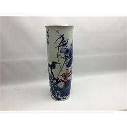 Chinese floor vase of cylindrical form decorated in blue, white and red wih birds perched upon blossoming branches, with flared rim, H62cm