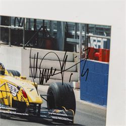 Ten signed Formula 1 photographs, comprising eight Damon Hill examples, Jenson Button and a Nigel Mansell example, nine with certificates of authenticity from Write Stuff Autographs, all framed, largest H47cm, W67cm