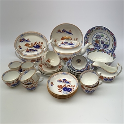 Early 19th century Spode Dolls House pattern tea wares, comprising teapot, twin handled sucrier and cover, milk jug, five teacups, two coffee cans, six saucers, stand, and shallow dish, decorated with a house and flowers in blue and orange, a number of pieces marked with pattern number 488, together with a quantity of other 19th century tea wares. 