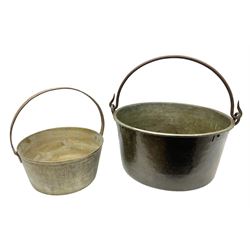 Two brass jam pans with cast iron handles, largest D49cm