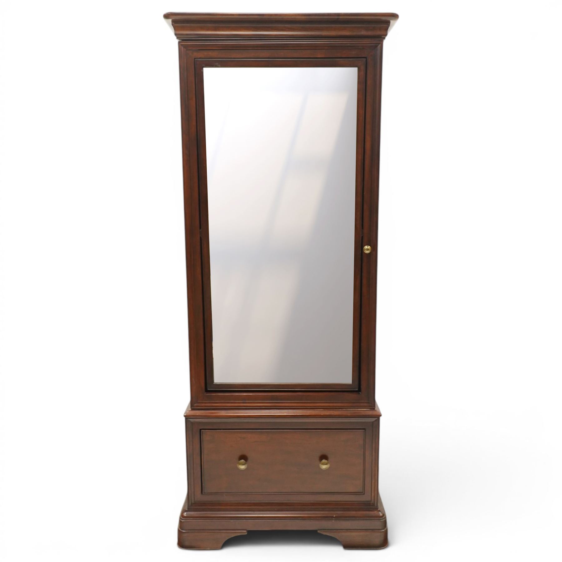 Willis & Gambier - hardwood swing mirrored door cabinet, in a dark cherrywood finish with moulded cornice over mirrored door incorporating adjustable cheval mirror action, enclosing a shelved interior, lower drawer with brass knob handles, panelled sides and stepped plinth base