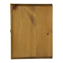 Pine chest of drawers topped with carved pediment with acorn and oak leaf motif, fitted with two short over three long drawers, standing on shaped apron base (W92, D46, H97cm); pine bedside cabinet, single drawer above paneled cupboard door enclosing open storage, shaped plinth base (W43, L32, H67cm)