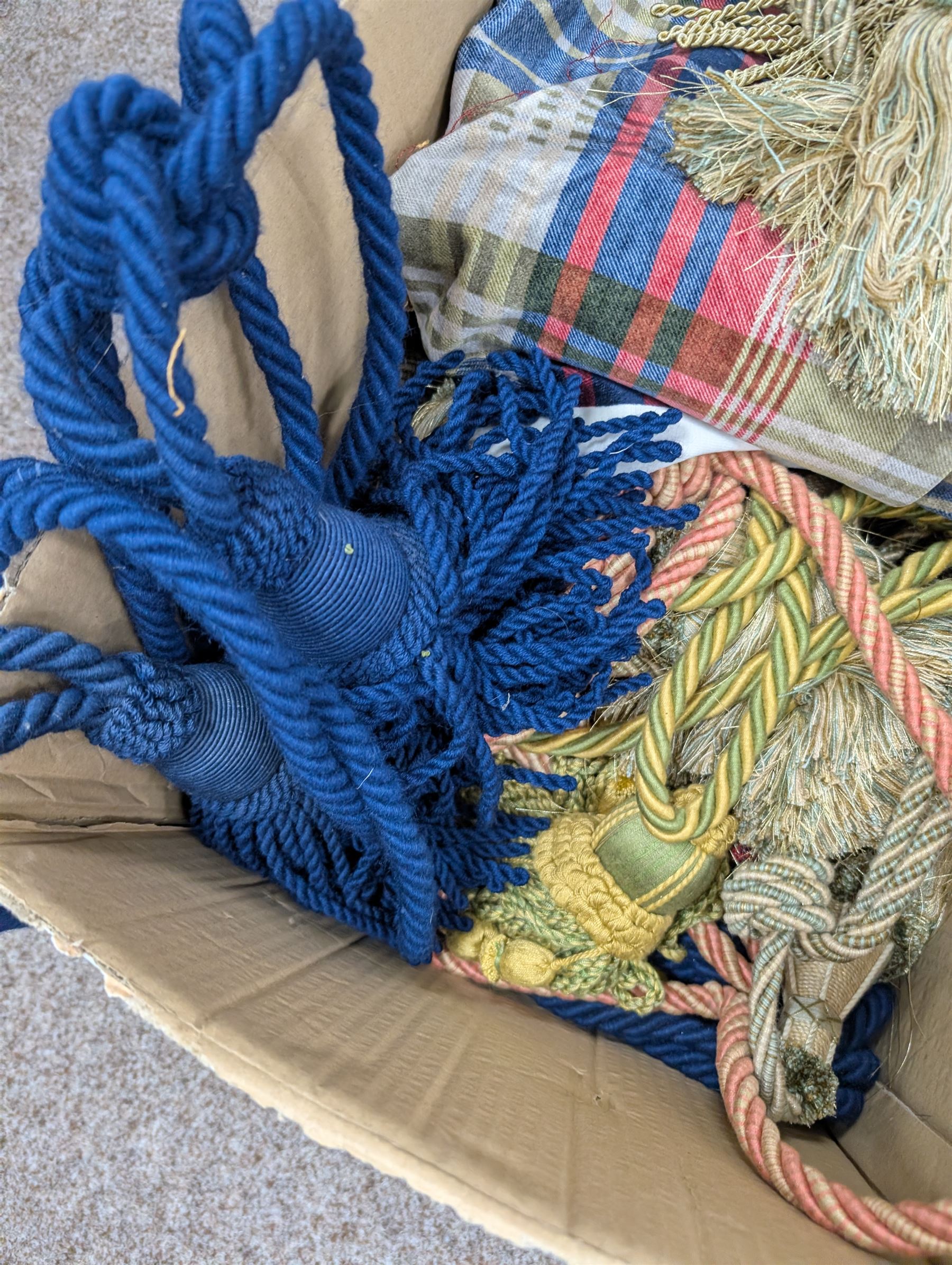 Collection of curtain fabric pieces and tassels