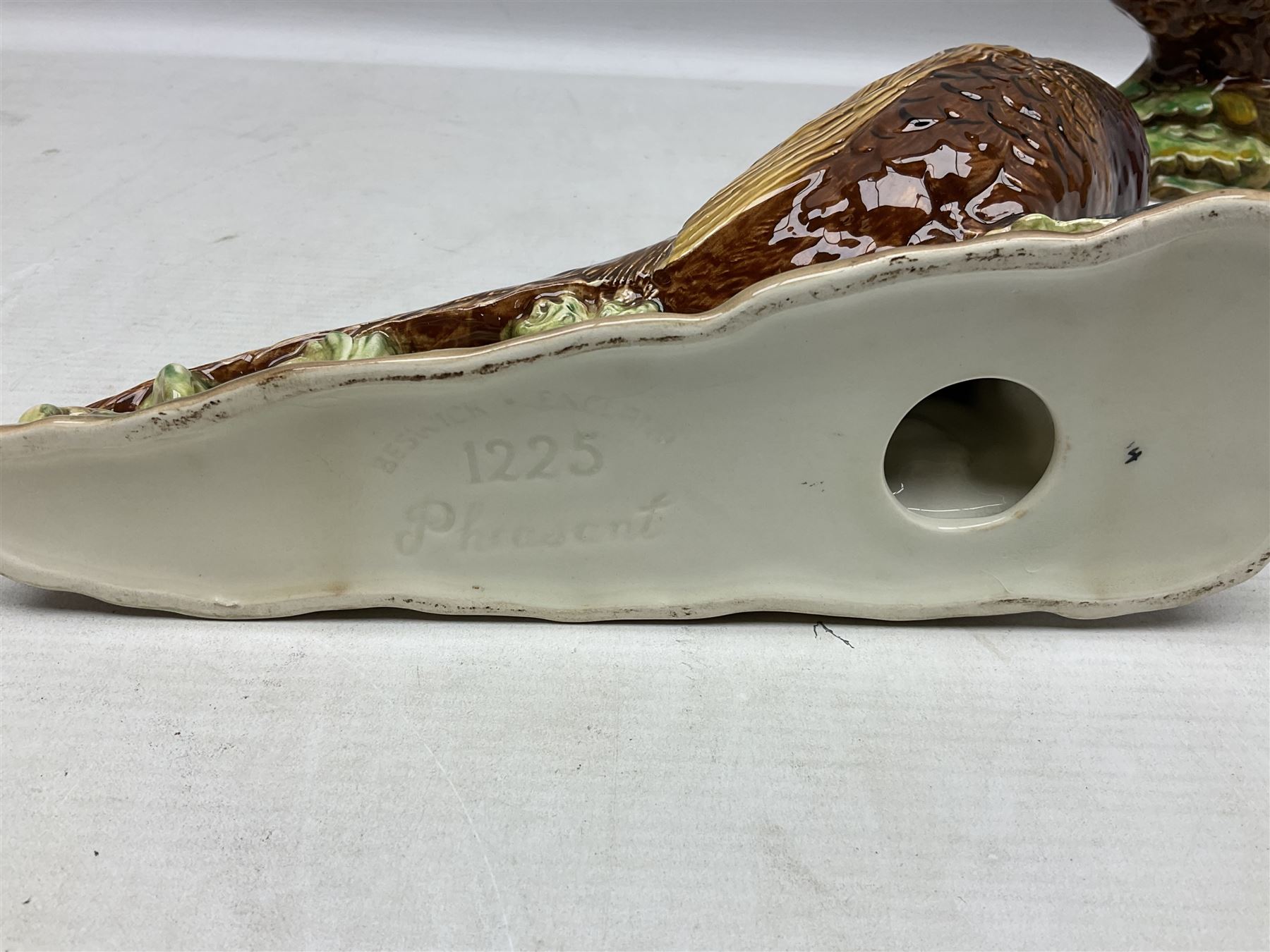 Three Beswick figures of birds, comprising pheasant no 1225, magpie no 2305 and woodpecker 1218, all with impressed marks beneath, tallest H22cm