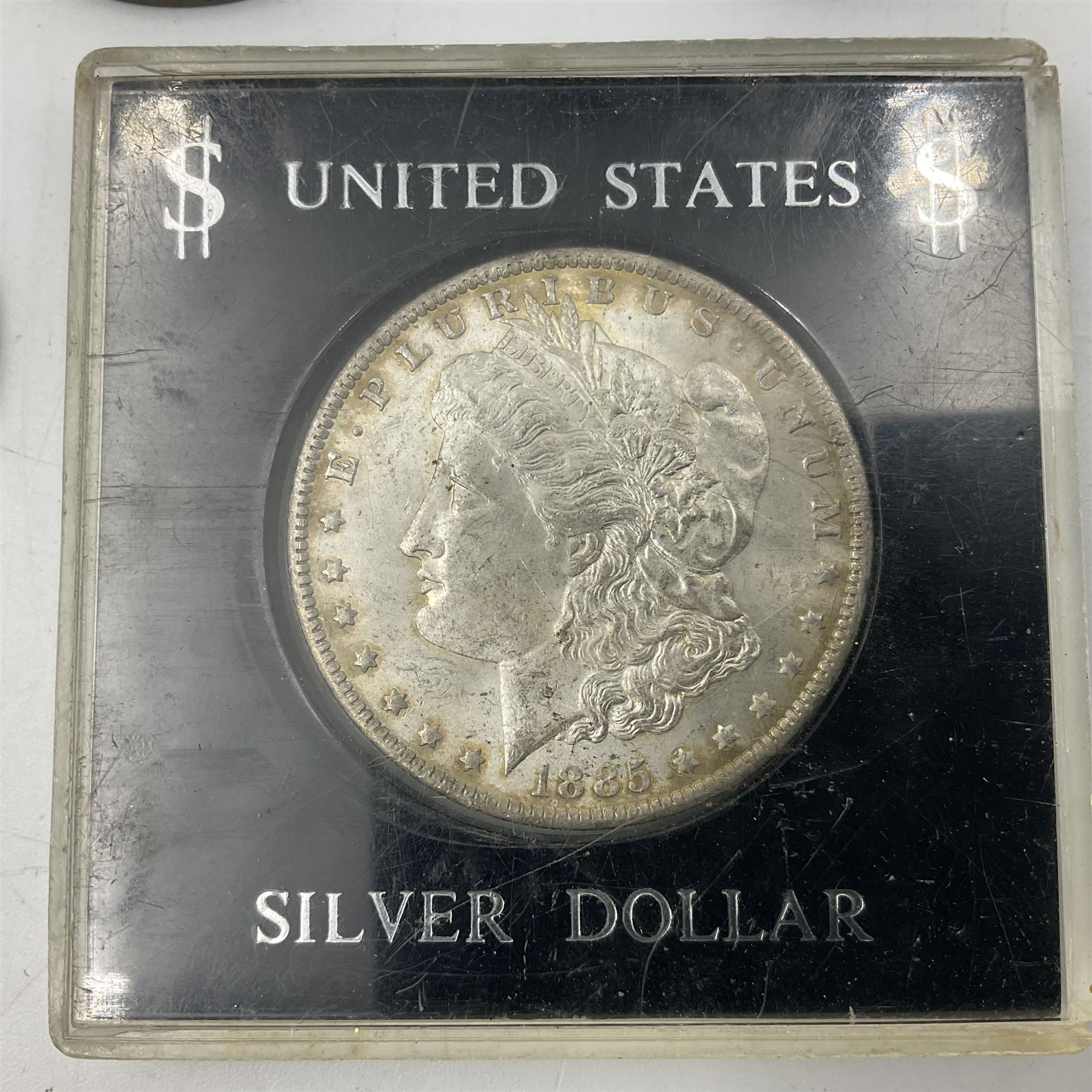 Two United States of America silver Morgan dollars dated 1885 O, 1888 O, King George V 1935 crown coin, and Mexico 1968 twenty-five pesos coin