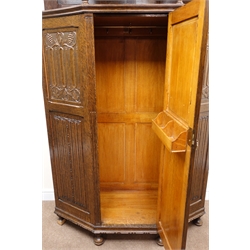 Large early 20th century carved oak hall wardrobe with shaped front, heavily carved, cup and cover supports, single panelled door, bun feet, W123cm, H201cm, D48cm  