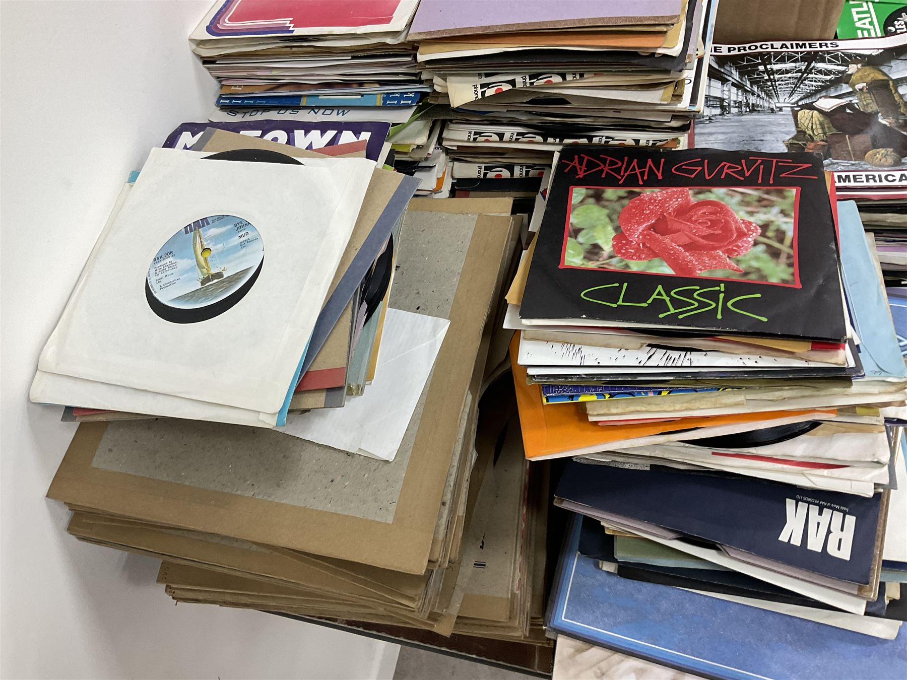 Large quantity of vinyl LPs to include Madonna, ABBA, The Carpenters etc, together with a quantity of 45rpm records, to include approx nine The Beatles The Singles Collection examples etc
