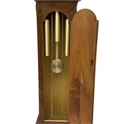 A bespoke handmade 20th century longcase clock in a slim Yew wood case with a German three train weight driven movement sounding the hours and quarters on 12 gong rods, with a brass break-arch dial, cast brass spandrels and an etched chapter ring, Roman numerals and minute track, dial engraved 'Parkinson Liner',  convex boss to the arch engraved 'Tempus Fugit', strike silent facility, With triple weights & Pendulum. 


