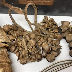 Collection of traditional necklaces from the Solomon Islands, including shell and boar tusk examples, together with a carved canoe prow, with mother of pearl eyes, painted cow hide and a copper plaque, depicting the Solomon Islands, with presentation engraving