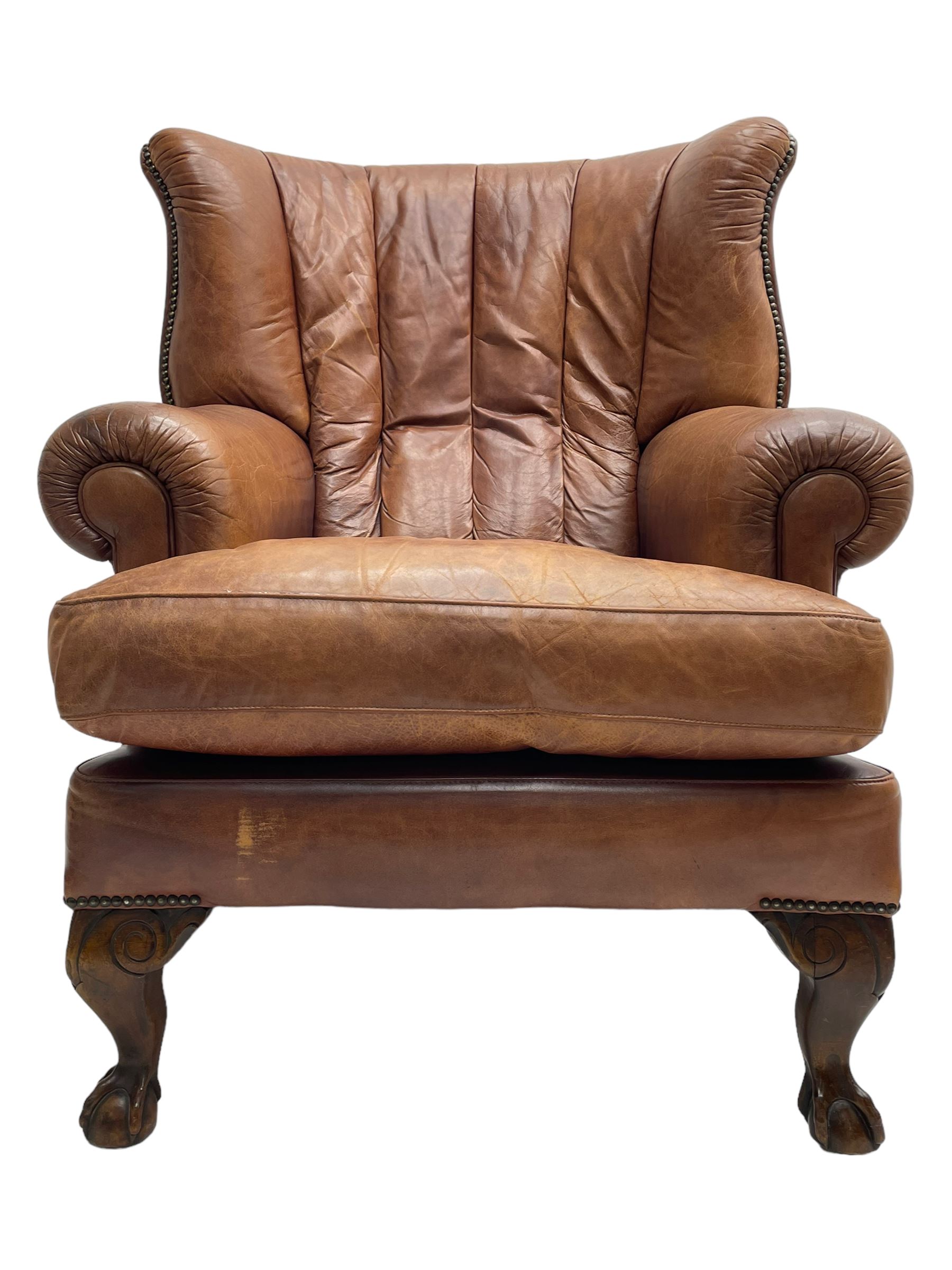 Tetrad - 'Blake' club armchair, fanned wingback and rolled arms upholstered in tan brown leather, on ball and claw carved cabriole feet 