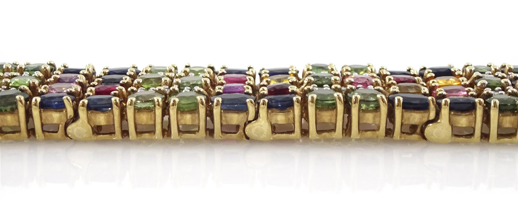 9ct gold sapphire, ruby and diamond bracelet, vari-cut blue fancy coloured sapphires, oval cut rubies and round brilliant cut diamonds, Birmingham 2006