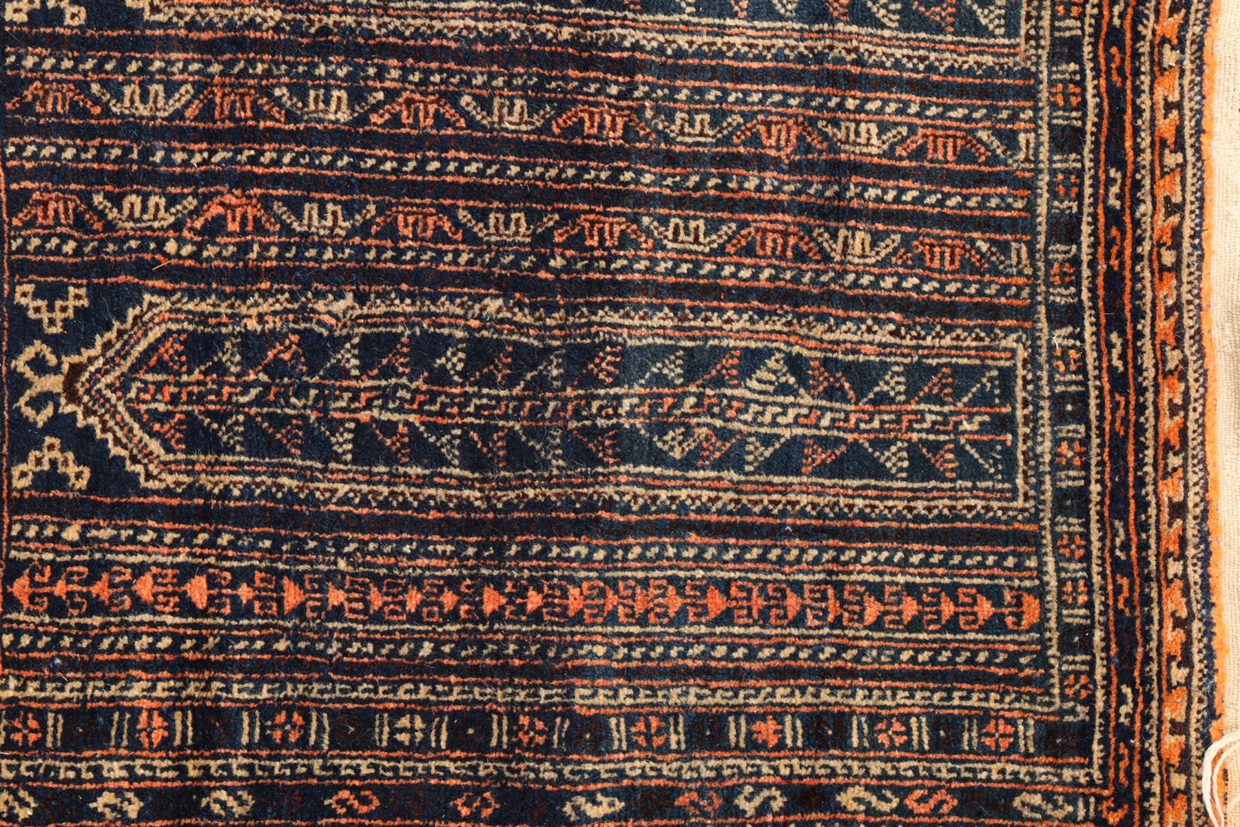 North Persian indigo ground tribal rug, the field decorated with stylised geometric motifs within vertical rows, the guard stripes with repeating hook motifs