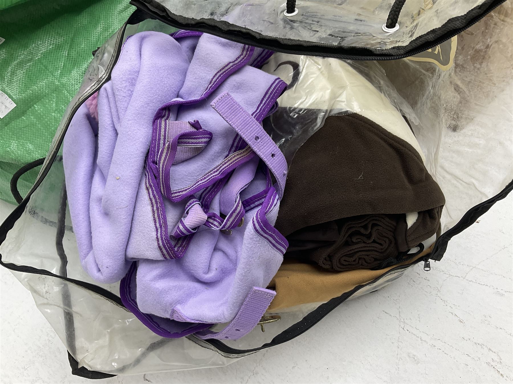 Quantity of horse tack and equipment to include Hauptner electric horse clippers, The Horseman Electric Clippers, bits, bridles, girths, rugs, jodpa boots etc  