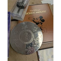 Collection of Disney memorabilia and ephemera, including Walt Disney Treasures DVD, two Disney Villains mugs, enamel pins, Mickey Mouse D23 fan club pack, Disney Twenty-Three magazines, Sketches magazines, etc