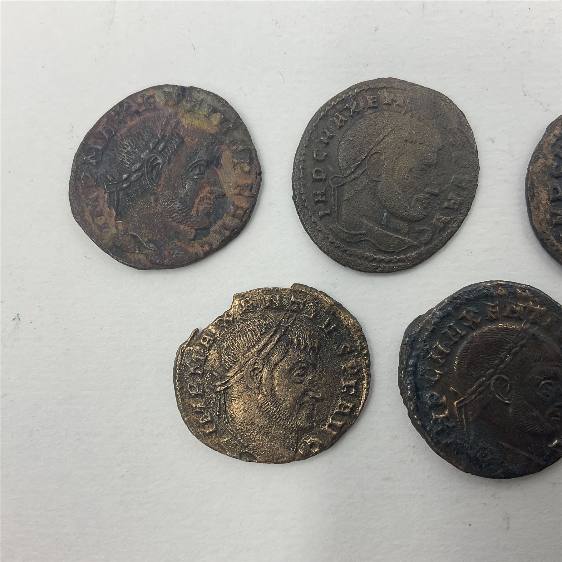 Roman Imperial Coinage, Maxentius (AD 306-312), fourteen bronze folles, most bearing rev. Roma seated in temple holding globe and sceptre (14)