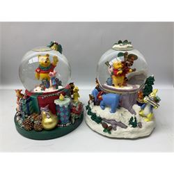 Six Disney Winnie the Pooh Christmas snow globes, comprising large Mr Christmas Holiday Snowfall, An Enchanted Christmas, It's A Small World Christmas 1994,  Tree Trimming, 1995 Christmas At Our House and Christmas Band Concert, together with Mr Christmas Holiday Go Round, all with boxes (7)