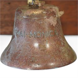 Set of three brass ship bells, each with wall bracket and two with rope pulls, mounted on a rectangular mahogany backboard with brass plaque inscribed ‘Ship and House Bells Engraved to Order’