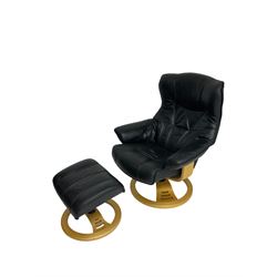 Anderssons of Sweden - mid-20th century design swivel armchair, upholstered black leather, raised on beech U-frame supports with circular base, together with matching footstool 