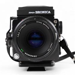 Zenza Bronica ETRS medium format camera, serial no. 8301079, with Zenza Bronica Zenzanon EII 1:2.8 f=75mm lens with lens cap, serial no. 7955198 and two film backs and instruction booklet