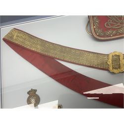 Victorian / Edward VII Queens Own Hussars Officers Full Dress Pouch and Cross Belt; scarlet cloth covered leather pouch with bullion embroidered crown, laurel bordered regimental crest within an edge of embroidered bullion wire; with its original officers cross belt with fine regimental pattern brocade to the top and gilt metal furniture; displayed in a wall hanging case with cloth and metal regimental badges; mahogany stained frame 44 x 54cm