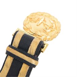 British 1827 pattern Naval officer's sword, named, by Wilkinson Sword Company in 1920 for P.H. Earle and retailed by Gives, the 80cm slightly curved blade etched to both sides, the brass guard held into scabbard by patent spring clip, lion head pommel and backstrap, with sword knot, within leather scabbard with three brass mounts, twin suspension rings and attached belt and suspension straps with gilt buckle and braid, overall L98cm 