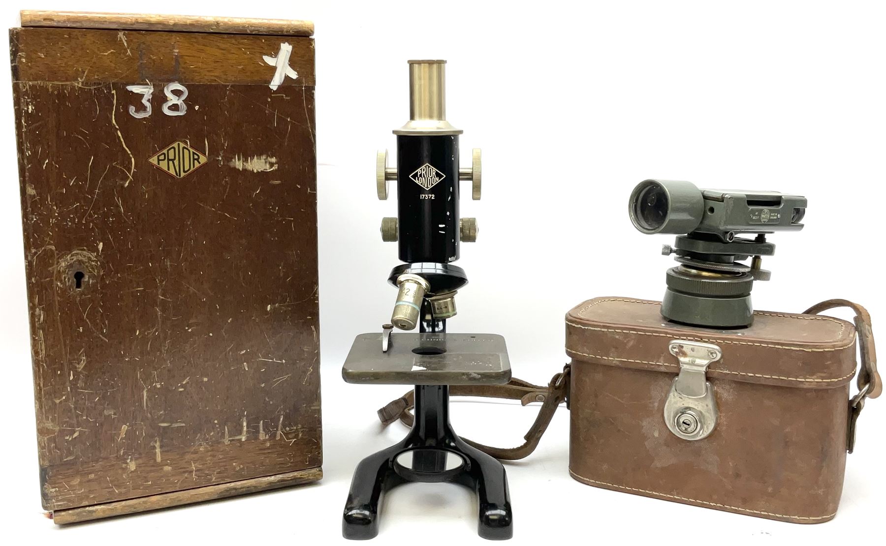 Black finished monocular microscope by Prior London No. 17372,  with pitchfork base and rack and pinion focusing, in original fitted wooden case with additional lenses, H32cm, together with Watts dumpy level, no. 116249, in a leather case