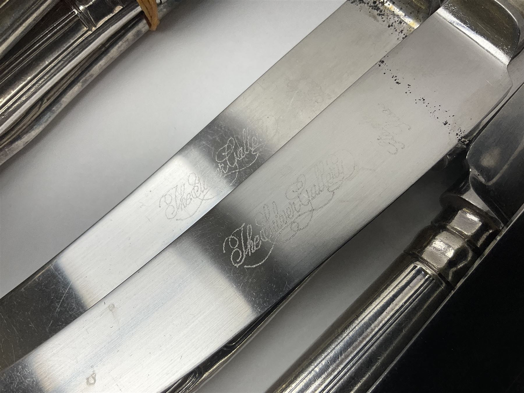 Silver Kings pattern knife, hallmarked Walker & Hall, together with a quantity of silver plated Kings pattern cutlery, including items by Osbourne's and United Cutlers, comprising table knives, table forks, table spoons, serving forks, ladle, berry spoons, teaspoons, dessert forks, cake slice, etc