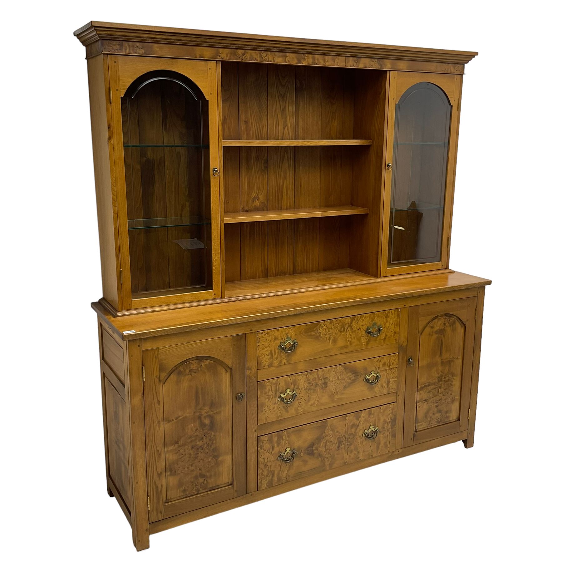 David Shackleton of Snainton - highly figured elm dresser, projecting moulded cornice over raised display cabinets and shelves, the base fitted with three central drawers and flanked by panelled cupboards, inscribed 'DS 1990'