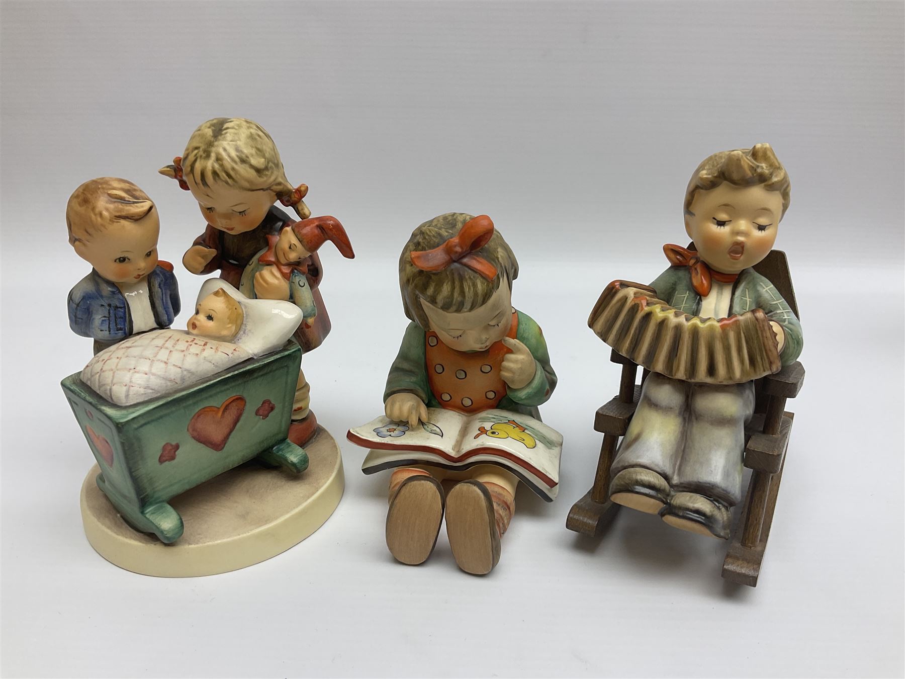 Twenty five Hummel figures by Goebel, to include Tuning up, Blessed Event, Book Worm, The Little Architect etc 