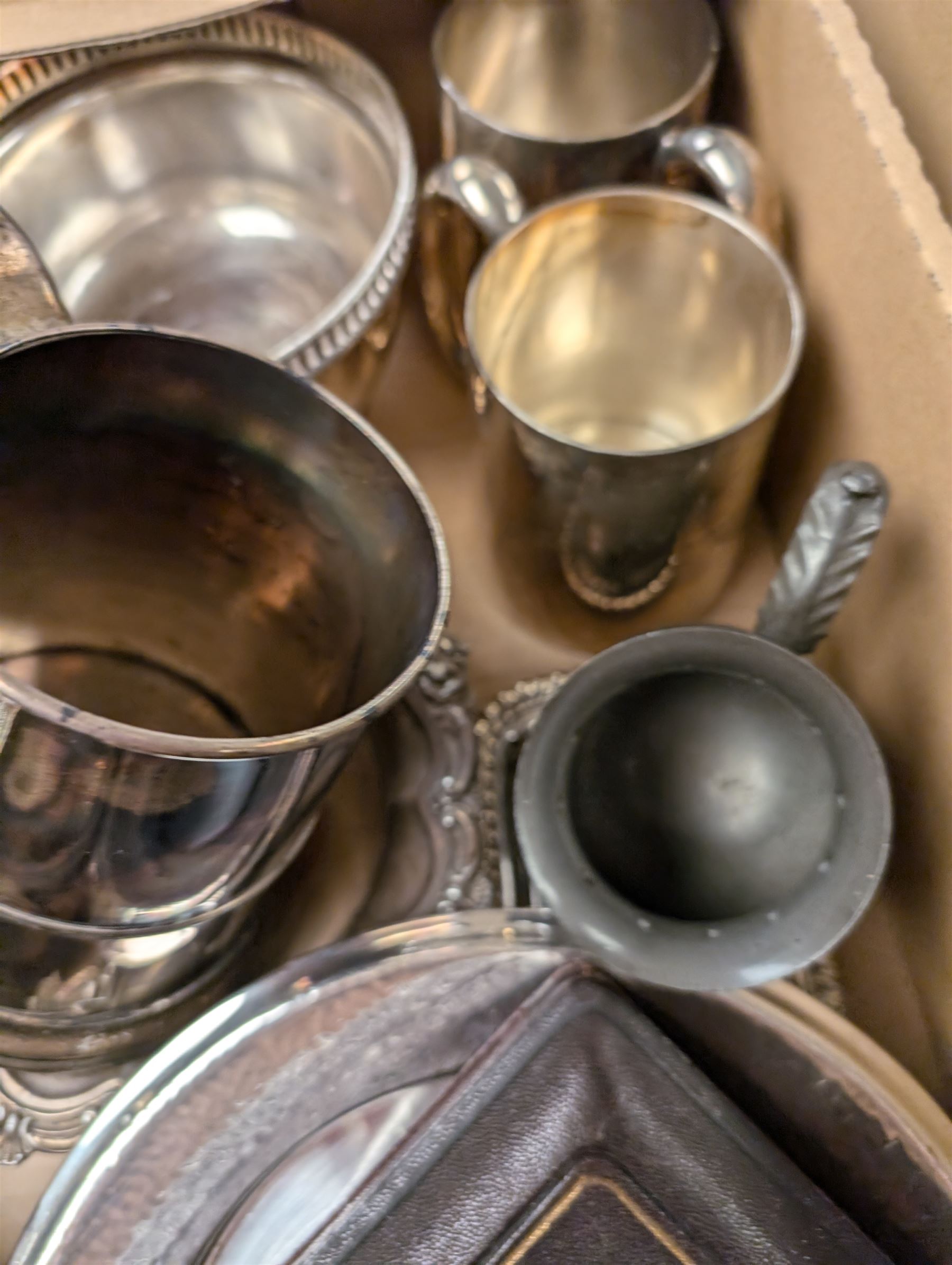 Silver plated items, including coffee pot with bone finial, set of six cased teaspoons and sugar tongs, twin handled cup, tankards, bottle coasters and sauce boat, together with pewter tankard and other metal ware