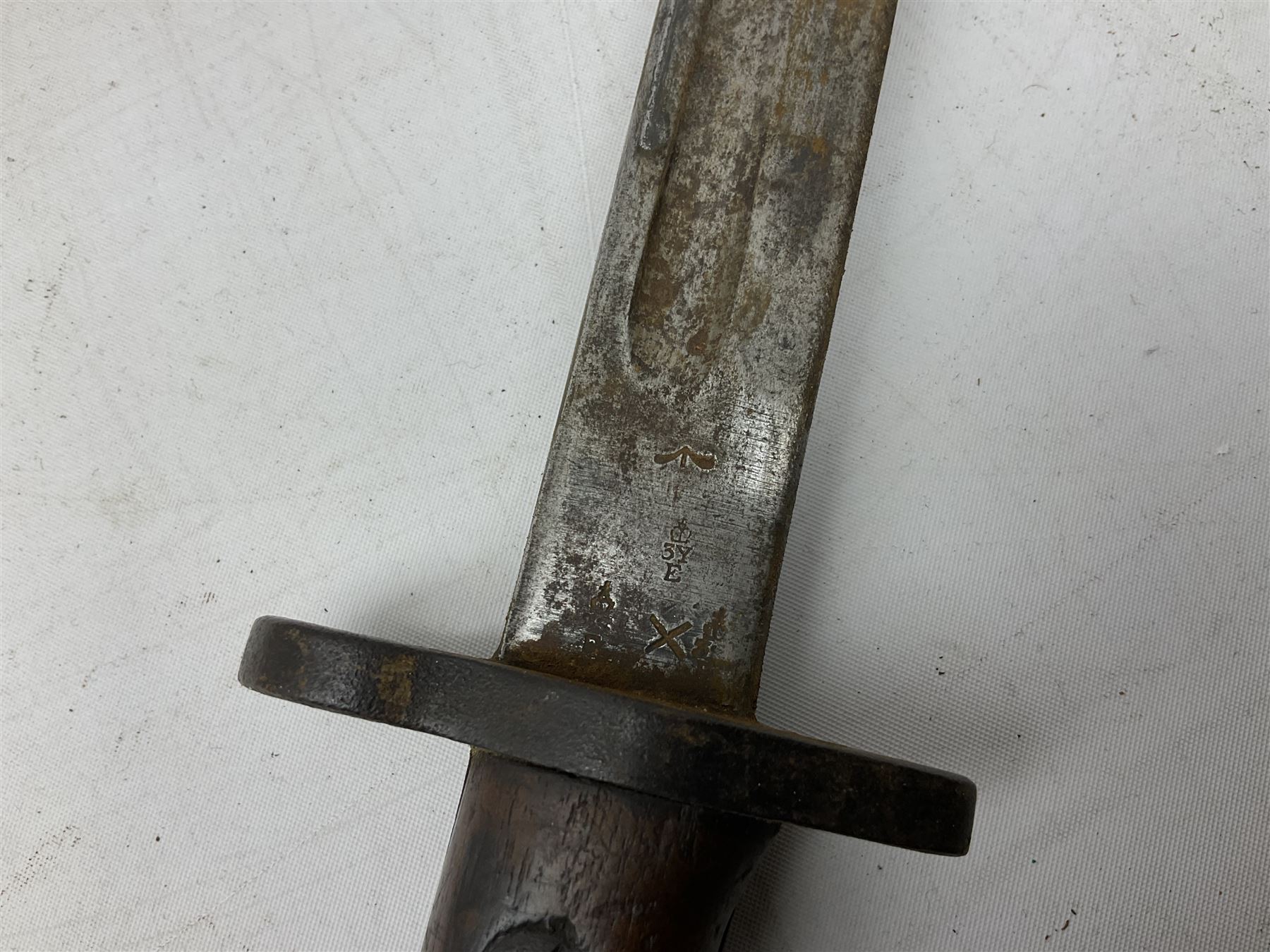 British Pattern 1907 bayonet with 43.5cm fullered steel blade; in leather scabbard with webbing frog L58cm overall; another Pattern 1907 bayonet lacking scabbard; and British Pattern 1888 Mk.I bayonet by Wilkinson London (no scabbard) (3)