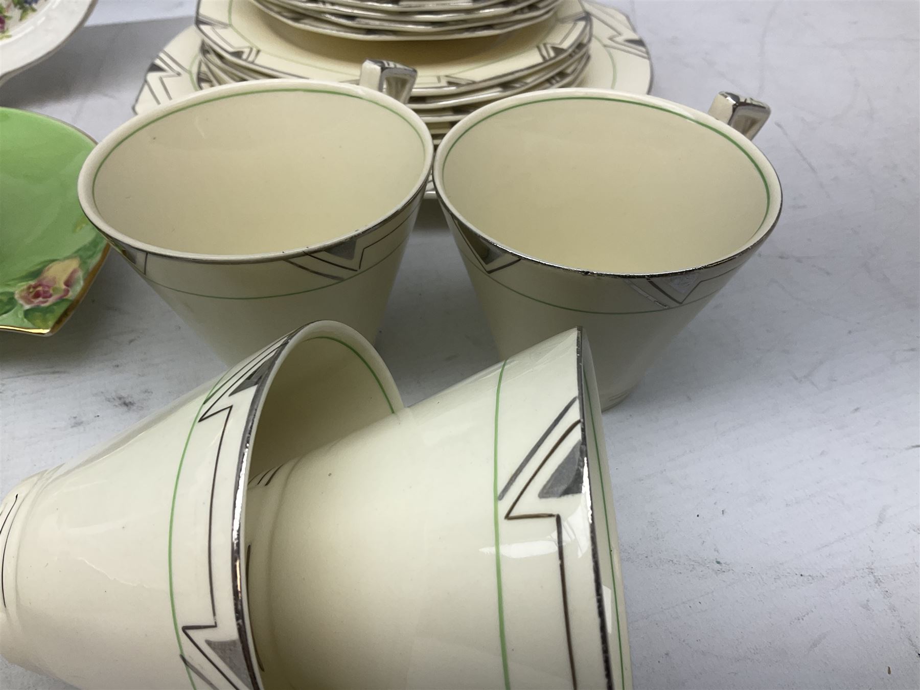 Art Deco style tea service by Alfred Meakin in Marigold pattern, comprising four cups and saucers, six dessert plates, one side plate, milk jug and sugar bowl, together with an art deco teapot, Royal Winton wares etc 