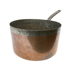 19th century large and heavy seamed copper saucepan with fixed iron handle, impressed 'Harrods Stores Limited London', with family crest of a crown over a letter 'C', L61cm
