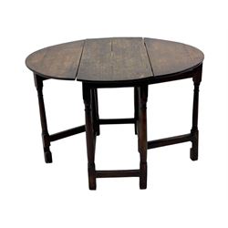19th century oak gateleg table, the oval drop-leaf top formed of four planks, on turned column supports united by rectangular stretchers