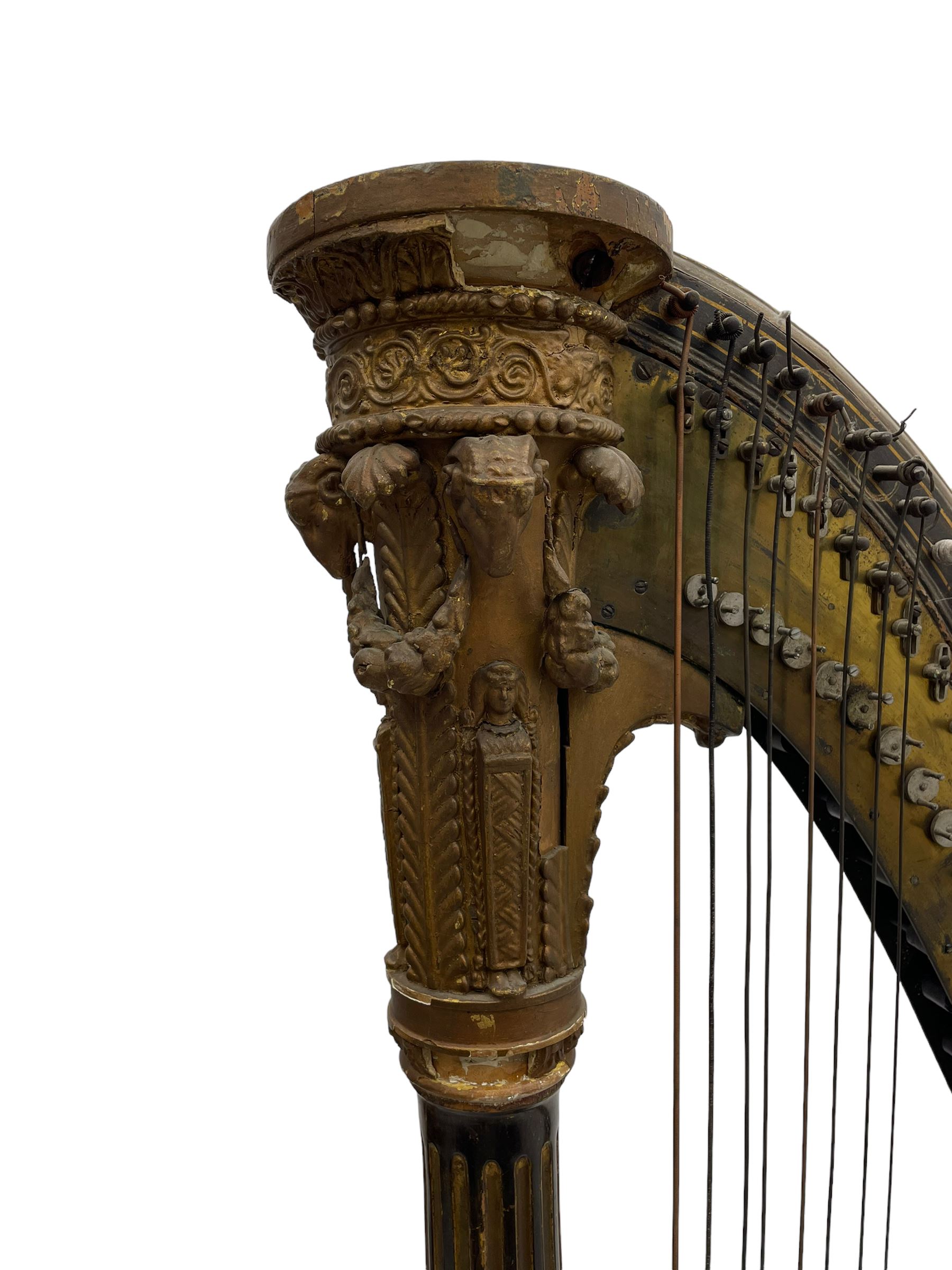 J. Erat. Wardour Street, London, Soho - Regency parcel-gilt and rosewood finish pedal harp, forty-three strings and five swell doors, the fluted pillar decorated with rams head capital, floral festoons, anthemion motifs and sarcophagi, the base decorated with pharaonic motifs and fitted with eight brass pedals, on carved paw feet, brass signature plate to top inscribed 'J. Erat. Wardour Street, London, Soho, 606'