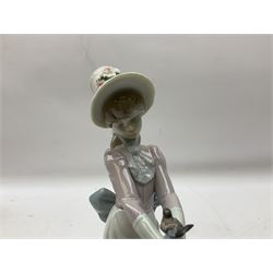 Two Lladro figures, comprising Garden Classic, no 7617 and Garden Song, no 7618, with original boxes and artists signature beneath, largest example H23cm