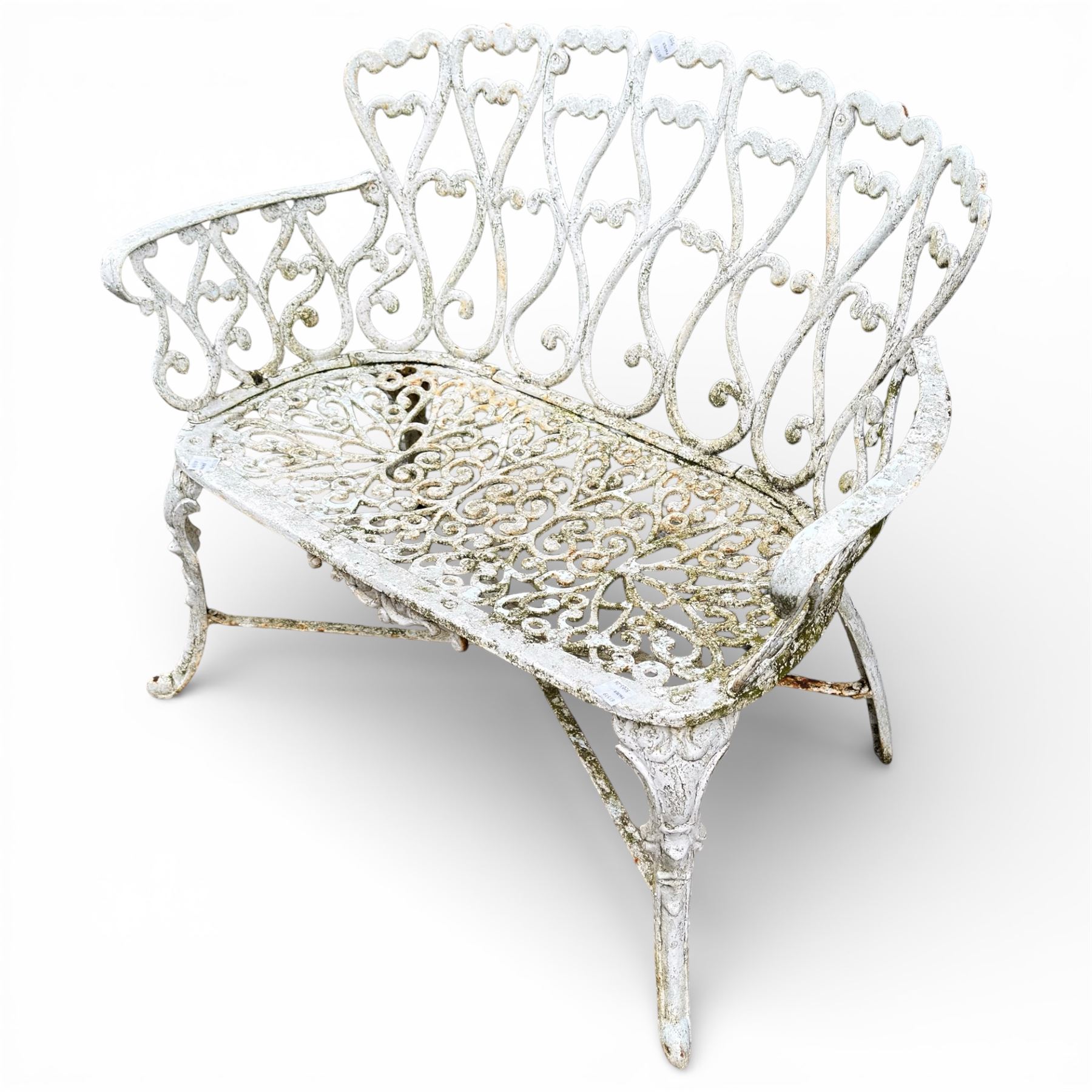White cast metal garden bench in an antique style