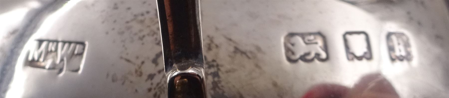 1920s four piece silver tea service, comprising teapot, coffee pot, milk jug and open sucrier, each of bellied form with oblique gadrooned rim and girdle, the teapot and coffee pot with Bakelite style handles and finials, each upon four bun feet, hallmarked Mappin & Webb Ltd, London 1925, coffee pot H22.5cm