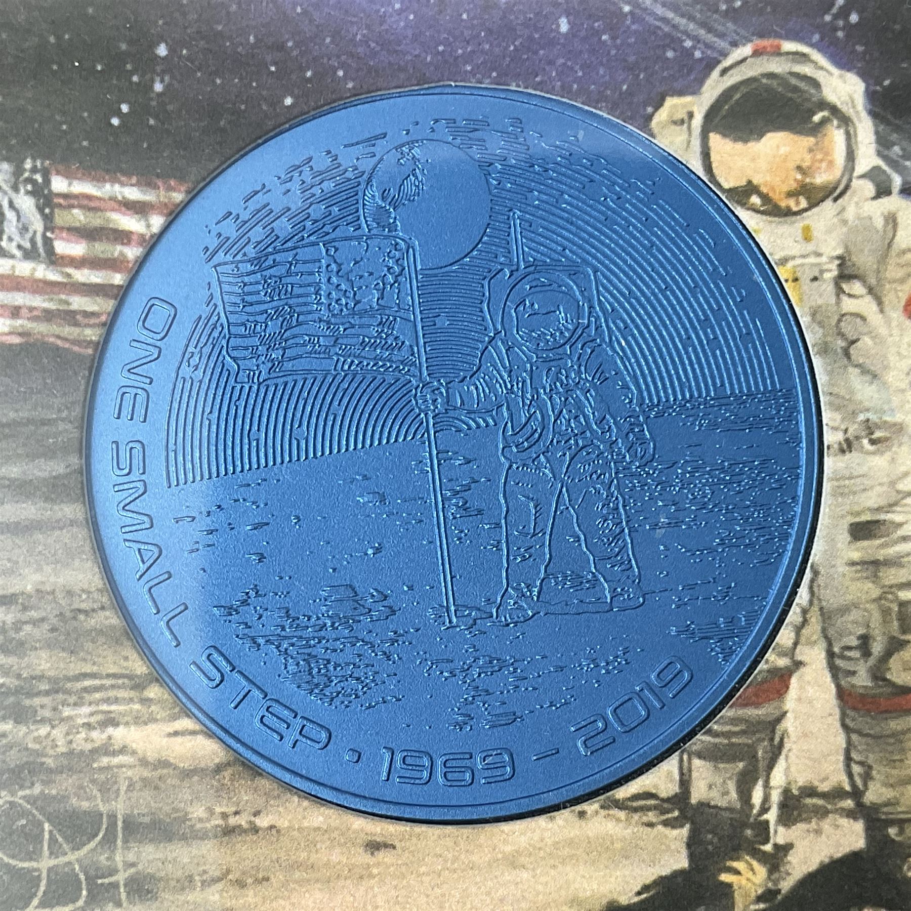 Queen Elizabeth II Bailiwick of Guernsey 2019 'The Titanium Moonlanding' fifty pence three coin set, comprising 'Green', 'Orange' and 'Blue' titanium coins, in capsules and case with certificate