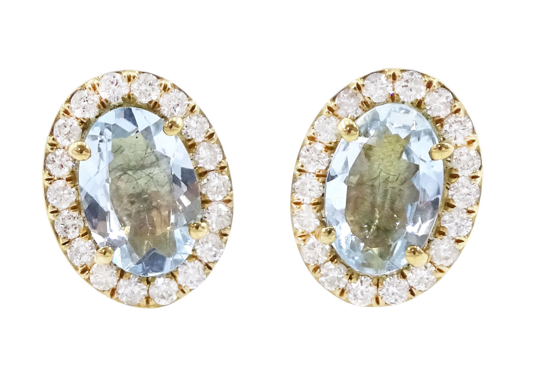 Pair of 9ct gold aquamarine and diamond earrings, each stud set with an oval cut aquamarine, with round brilliant cut diamond surround, stamped, total aquamarine weight approx 0.75 carat, total diamond weight approx 0.15 carat