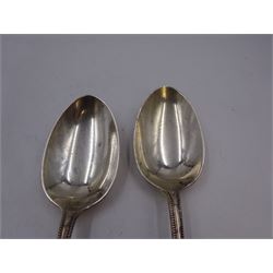 Pair of early 20th century silver Old English pattern table spoons, with beaded rim, hallmarked Walker & Hall, Sheffield 1912