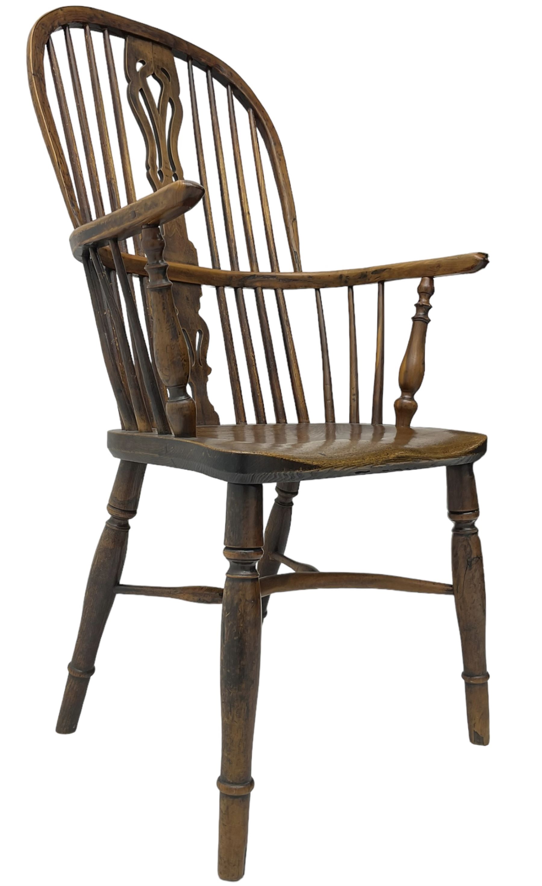 19th century yew wood and elm Windsor chair, high hoop and stick back with pierced splat over dished seat, raised on ring turned supports united by crinoline stretcher