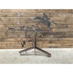 Black painted wrought iron weather-vane depicting hunting scene and compass points
