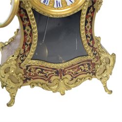 Louis XV-style gilt-bronze mounted turtleshell boulle mantel clock, the case of typical waisted form, gilt bronze foliate scroll and rocaille mounts, raised on scroll feet. Eight-day Paris movement signed “Rollin à Paris”, with outside count-wheel striking half-hourly on a single bell, the going train with anchor escapement. The circular foliate gilt bronze dial with enamelled Roman hour numerals and twin winding apertures, fitted with pierced blue steel hands and bevelled glass cover, with pendulum and key, circa 1860