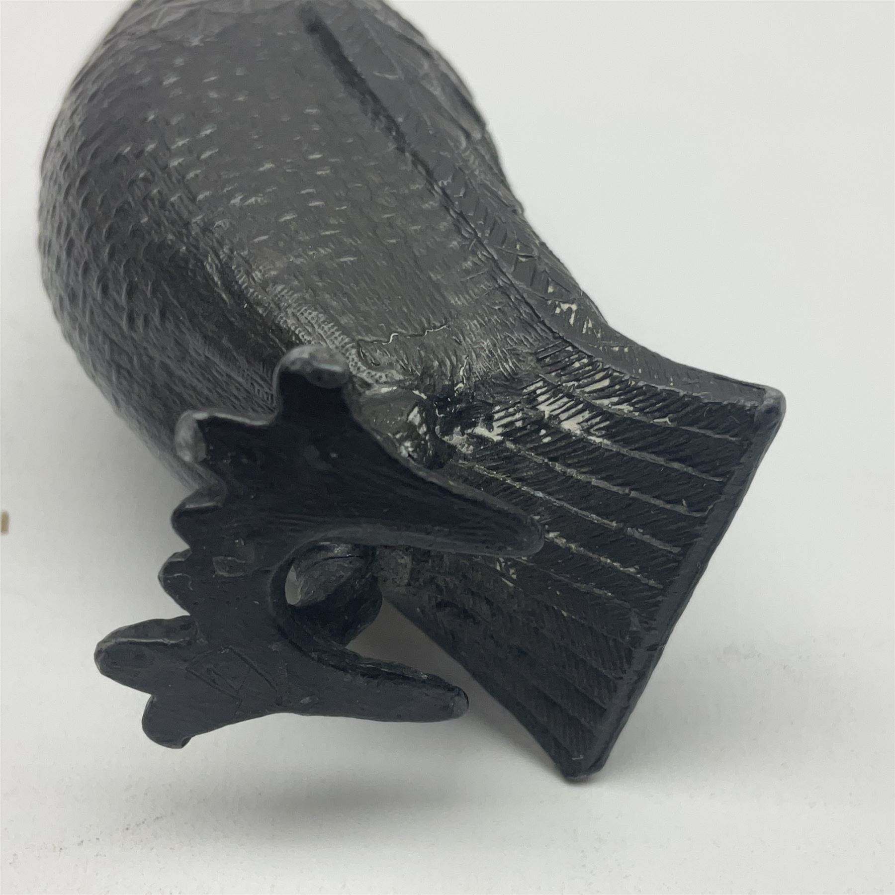 Novelty pewter pepper shaker in the form of an owl with screw off head and glass eyes