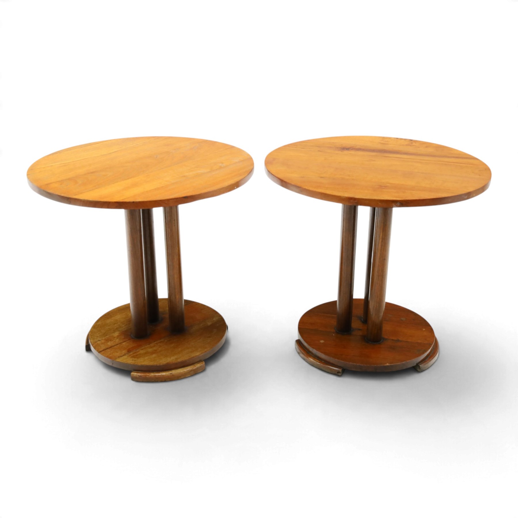 Pair of early 20th century oak lamp tables, circular tops raised on cluster-column pedestals, with circular platform bases and shaped bracket feet (2)