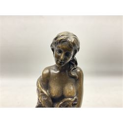 Art Deco style bronze modelled as a female figure seated upon a chair holding an apple, after 'Pierre Collinet', H28cm