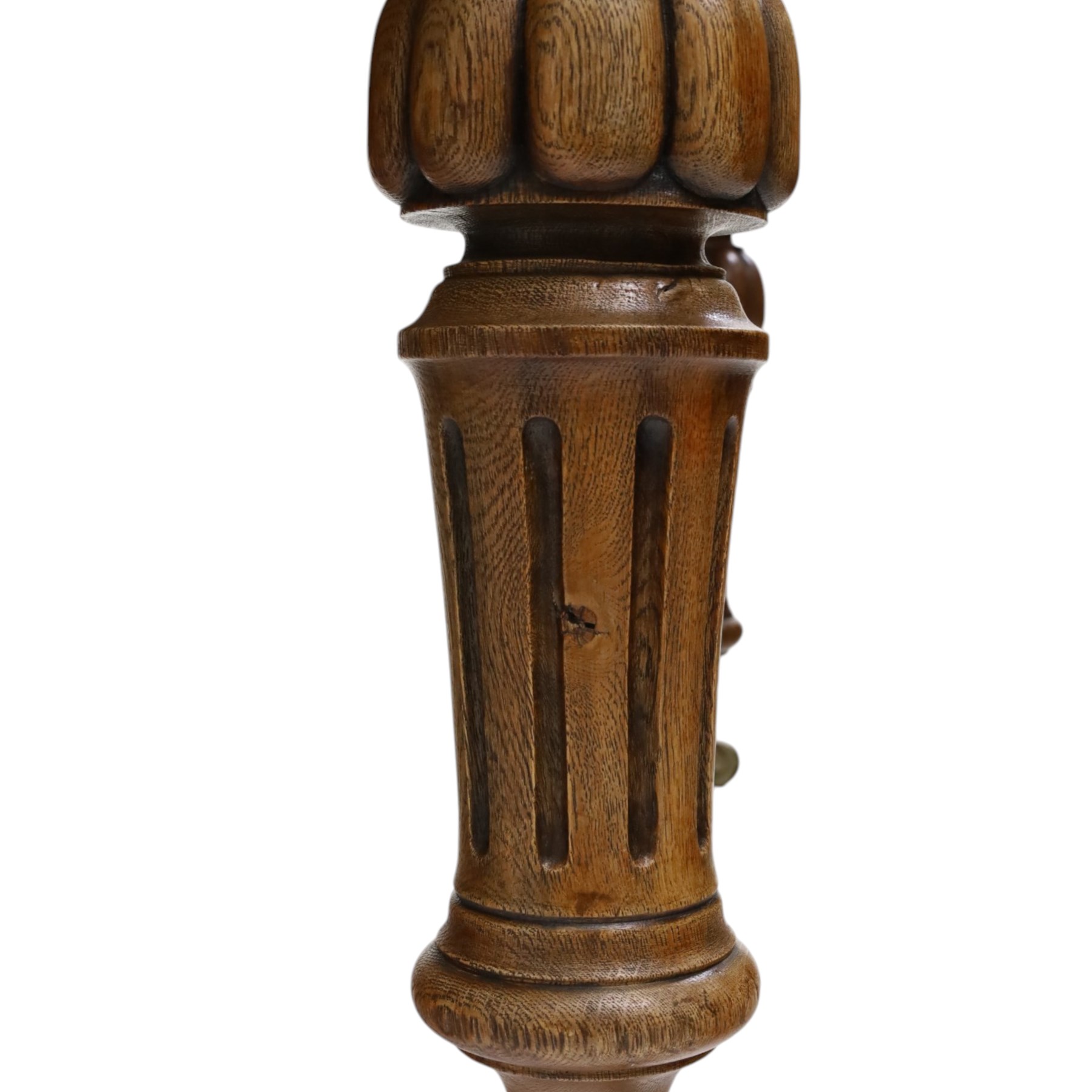Large Victorian oak extending dining table, the rectangular top with rounded corners and moulded edge, plain frieze over large turned lobed and fluted supports terminating to brass cups and castors, with two additional leaves
