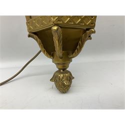 Brass and glass wall lantern of half hexagonal form and a three branch light fitting, with goat mask detail and topped with three feathers, H80cm